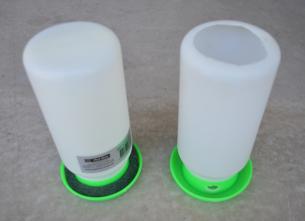 Photo of a insect food and water dispenser for insects such as crickets and cockroaches. Made from chicken water dispenser, white reservoir and green base.